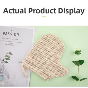 Close-up of natural linen exfoliating bath glove with woven hanging loop on green background