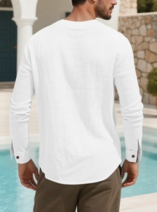 Detail of white cotton linen men shirt back view showing texture in outdoor resort setting