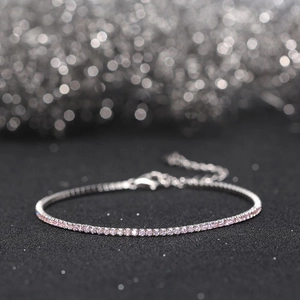 Macro shot of 1.5mm pink cubic zirconia stones on a S925 sterling silver tennis bracelet