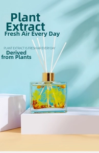 Detail of 100ml square glass bottle with dried flowers and reed diffuser sticks