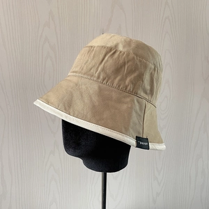 Classic khaki cotton bucket hat for women with white contrast trim and side logo label