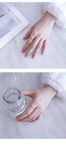 Macro shot showing thin minimalist zircon rings in gold, silver and rose gold finishes