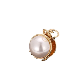 Elegant gold metal hair claw clip with large central pearl and star cutout patterns