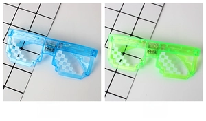 Close-up of LED mosaic pixel glasses with built-in battery compartment and circuitry