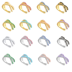 Macro display of S925 silver crossover ear cuffs featuring multi-color zircon stones