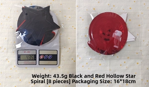 Detailed view of black and red 25th anniversary star swirl decorations and packaging