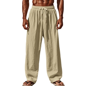 Close-up of beige cotton linen wide leg pants featuring adjustable drawstring waist