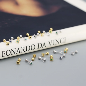 Detailed shot of sterling silver star stud earrings with colorful zircon inlays