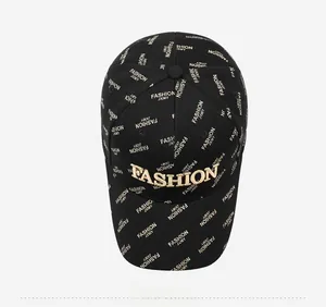 Top view of a black baseball cap with gold 3D embroidery and all-over letter print