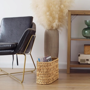 Close-up of handmade wicker storage basket with intricate texture and side handles