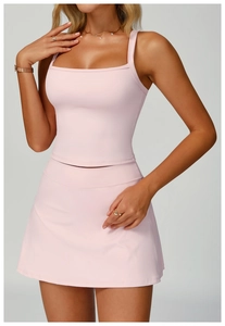 Detail of square neck yoga tank top and A-line skirt in light pink breathable fabric