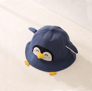 Detailed view of kids penguin sun hat with cute 3D wings and navy blue cotton fabric