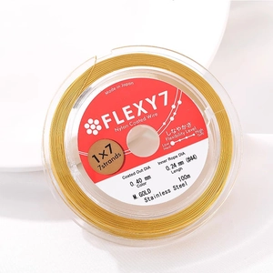 Macro detail of 0.40mm gold stainless steel 7-strand beading wire for DIY jewelry