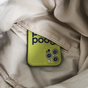 Neon green silicone iPhone Pro Max case stored in a beige canvas bag zipper pocket