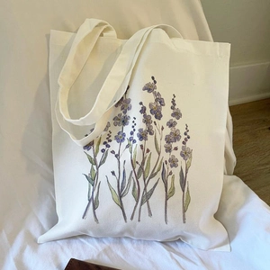 Floral print aesthetic canvas tote bag in cream white with purple flower pattern
