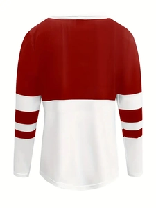 Detail of the back view showing red and white contrast stitching on a striped sweatshirt