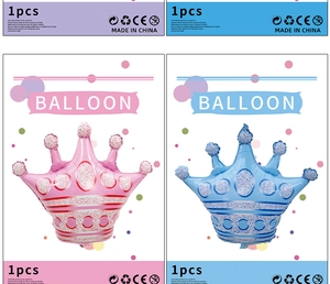 Detailed view of pink and blue princess crown foil balloons in retail packaging