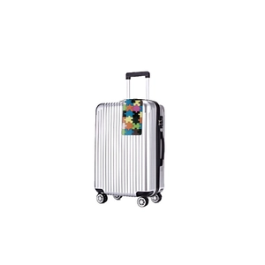 Valise rigide argentée avec 4 roues et étiquette de bagage à motif de puzzle coloré