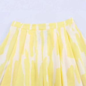 High waisted midi skirt with artistic yellow and white vertical stripes and waist pleats