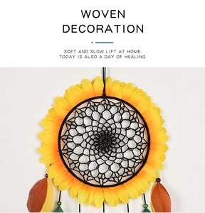 Detail of sunflower dream catcher featuring yellow petals and natural feathers for wall decor