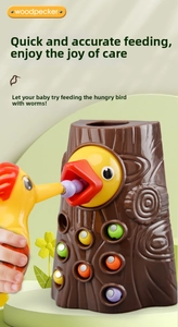 Close-up of magnetic woodpecker feeding toy with colorful worms and stump base