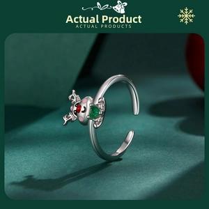 Detailed view of s925 silver reindeer ring with green heart stone and red nose detail