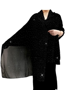 Macro detail of black chiffon evening shawl with silver rhinestones and sheer texture