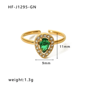 Detail view of adjustable gold ring with green teardrop zircon and pavé crystals, 1.3g