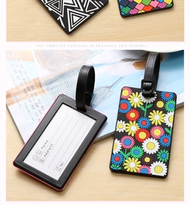 Detail of PVC luggage tag showing name and address card with floral sunflower design