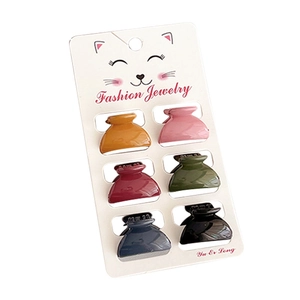 Set of 6 mini Morandi color hair claw clips for kids and women on a display card