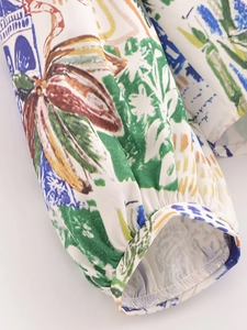 Close-up of elastic cuffs on women's blouse with vibrant graffiti art print
