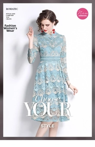 Detailed close-up of light blue floral lace embroidery on long sleeve elegant dress