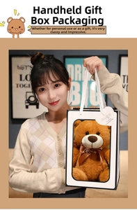 Brown plush teddy bear with satin bow in a premium white window gift box with heart tag