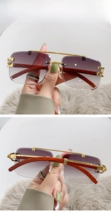Detail of pilot sunglasses with gold metal frame, dark wood grain temples and gradient grey lenses