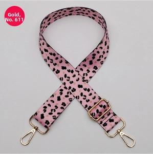 Pink leopard print wide strap with gold-tone swivel hooks and adjustable buckle
