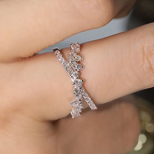 925 sterling silver double-layered crisscross ring with wave design and pavé diamonds