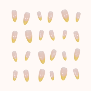 French oval press-on nails in yellow and nude featuring stars and hearts, 24 piece set