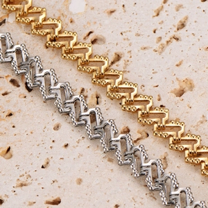 Minimalist stainless steel bead chains in gold and silver finish on a natural stone surface