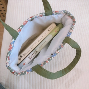 Internal view of floral canvas tote showing spacious capacity for books and essentials