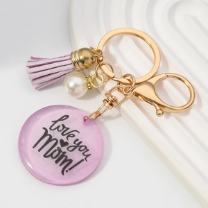 Porte-clés MOM doré avec pompon violet, perle et pendentif Love You Mom scintillant