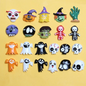 Set of 20 resin Halloween charms featuring skulls and pumpkins on a yellow background