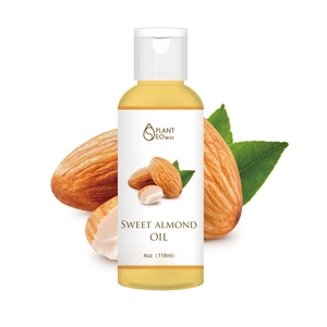 Natural Sweet Almond Oil 118ml in clear bottle with almonds on white background