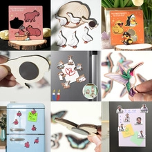 Detail of diverse wooden 3D animal magnets showing strong circular back magnetic structure