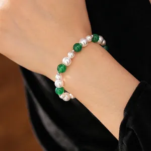 Vintage style beaded bracelet featuring green agate and white pearls with silver spacers