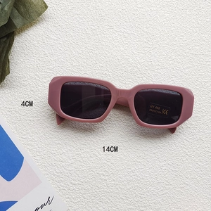 Detail of mauve rectangular kids sunglasses with UV400 lenses and dimension labels
