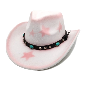 Pink western cowboy hat with star patterns and turquoise studded band on white background