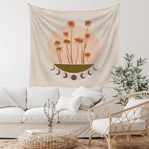 Detail of bohemian tapestry featuring palm trees, sunset and moon phases on beige fabric