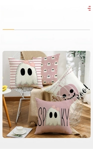 Set of four pink Halloween pillow covers with ghost and pumpkin motifs on white grid chair