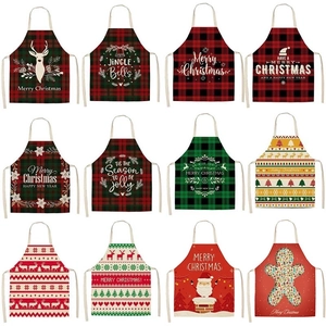 Collection of Christmas aprons with Santa, reindeer, and gingerbread man holiday prints