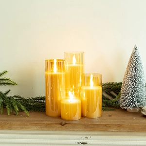 Set of 4 golden LED flameless candles in glass cups with warm glow for holiday decor